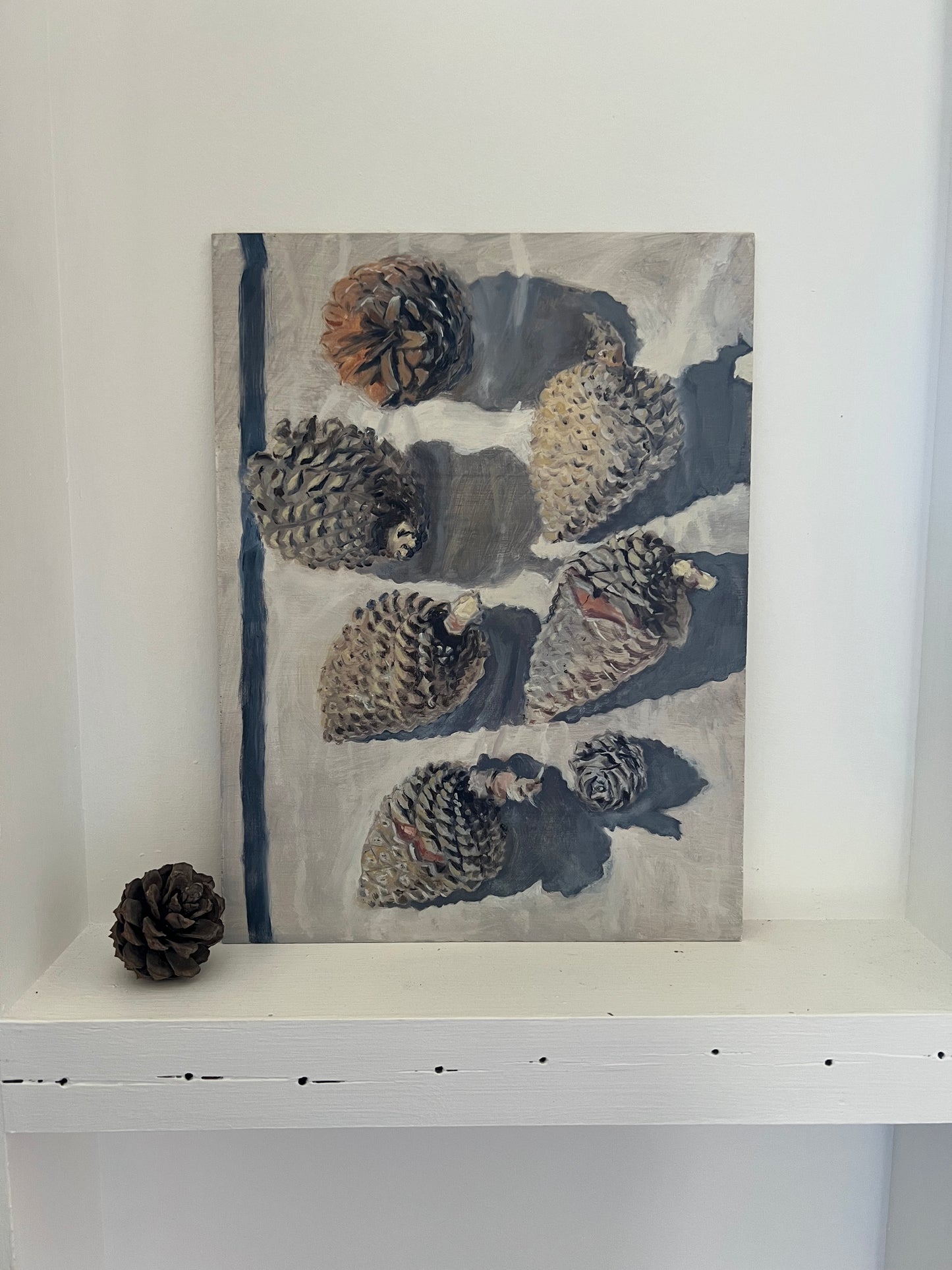 Simone Hale - Gathered Pinecones on a Navy Striped Tea Towel