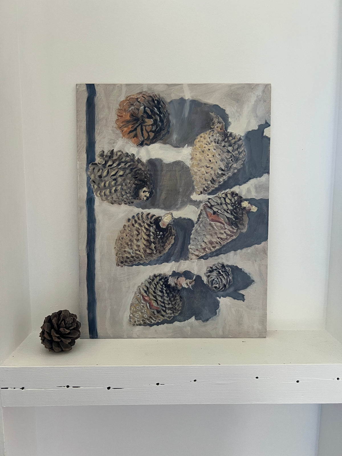 Simone Hale - Gathered Pinecones on a Navy Striped Tea Towel